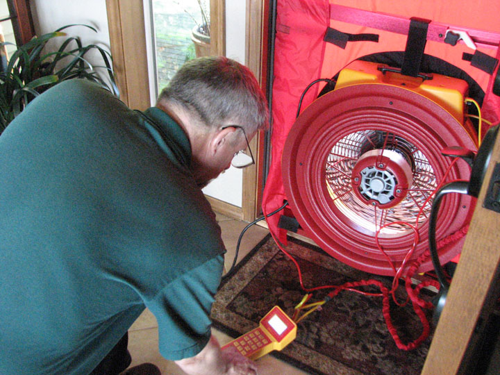 Photo of Greg Jourdan with blower door