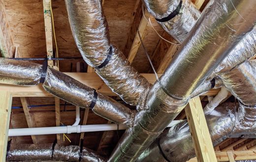 Insulated ducts running through crawlspace