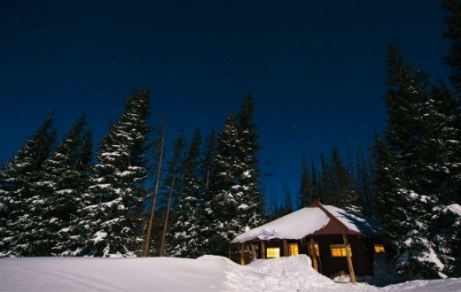 Low-Income Home Energy Assistance Program (LIHEAP) snowy home with lights on