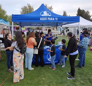 2075 Outreach_ Fiestas Mexicanas sm Photo of customers visiting outreach tent at Fiestas Mexicanas
