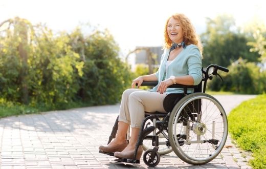 Woman in wheelchair smiling