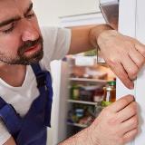 Person checking refrigerator seals