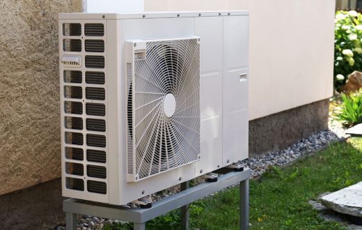 heat pump outdoor unit next to a house