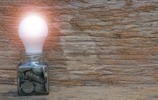 Helping Hand - lightbulb in jar with coins