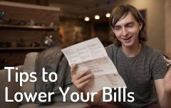 Chelan PUD customer reading electric bill with smile