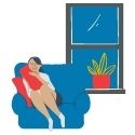 woman cozy on couch next to window