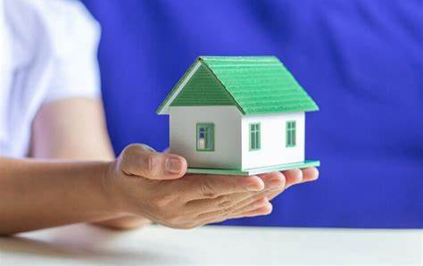 a small house in a person's hand