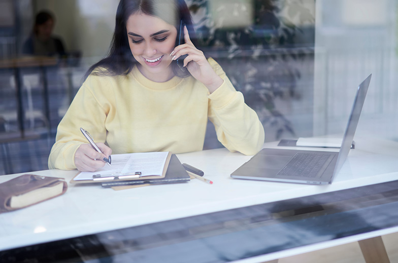 Picture of woman completing phone survey 