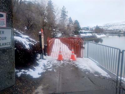 riverwalk boardwalk 3 Traffic cones and orange fence indicating temporary closure of a part of the RiverWalk trail