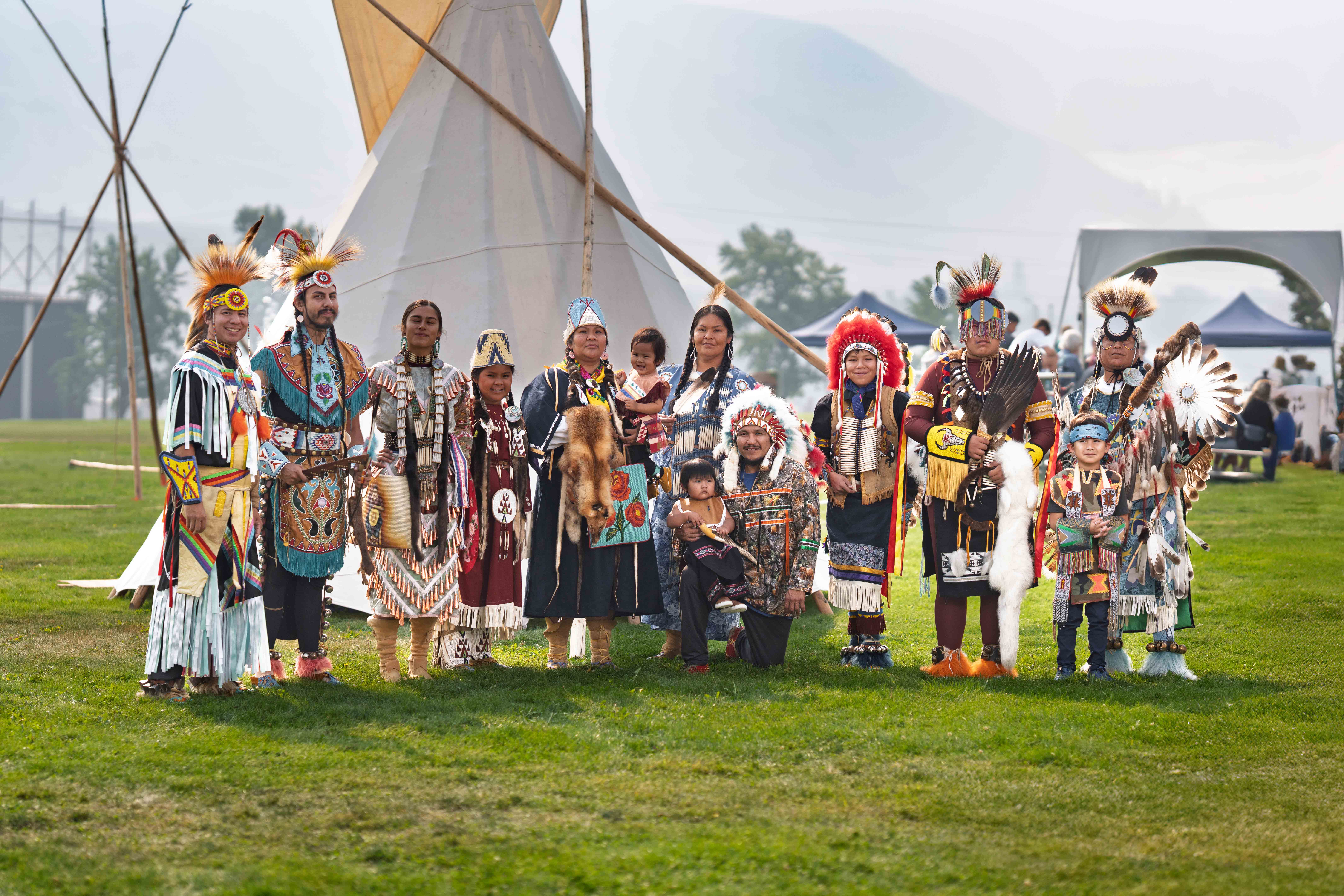 Native American dancers -- representing Choctaw, Tlingit, Nez Perce, Wanapum, Yakama Nation and Confederated Tribes of the Colville Reservation -- pose for a portrait during the Wenatchee River Salmon Festival 2025