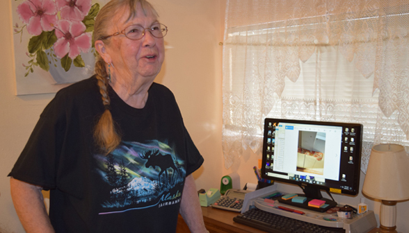 Vivienne Johnson shows window photo on her computer