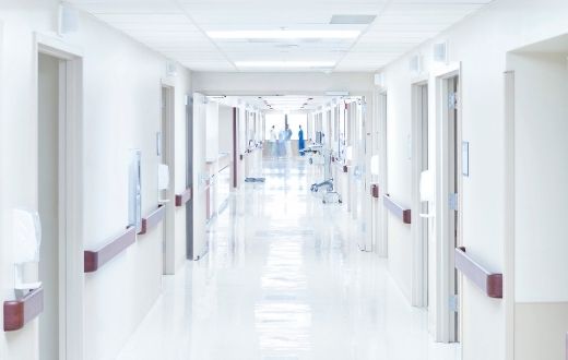 Hallway in hospital with staff in the far distance