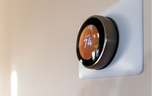 Smart thermostat on wall