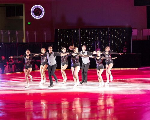 Winter Gala ice dancers with pink ice