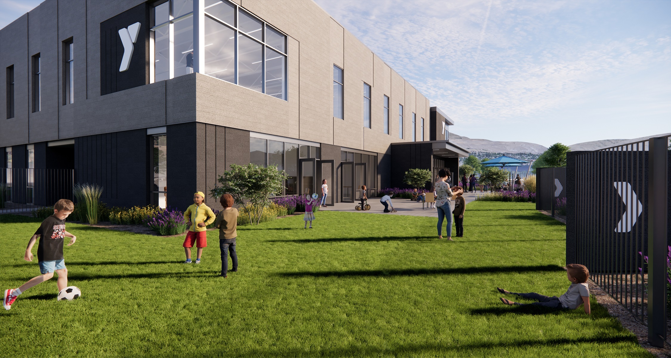 Artist rendering of children playing on lawn outside YMCA facility 